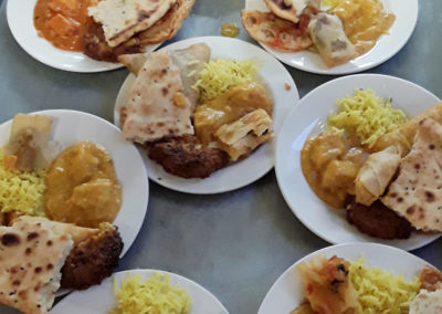 Plates of Indian Currey and naan bread