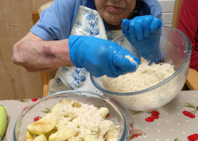 Resident mixing crumble ingredients at Lulworth House