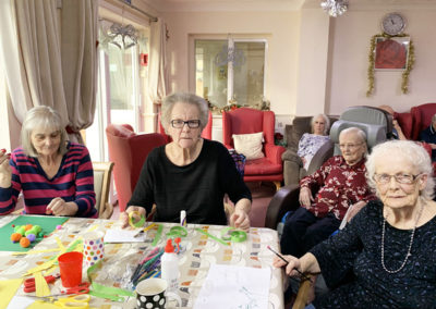 Lulworth House ladies doing some Christmas crafts together at a table