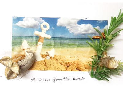 A Lulworth House resident's finished picture of a seaside background complete with shells and greenery