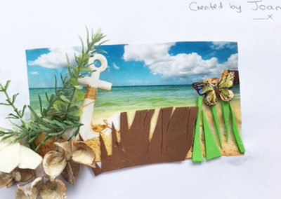 A Lulworth House resident's finished picture of a seaside background complete with shells and a colourful butterfly