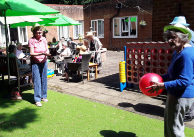 Residents playing catch in the garden at Lulworth House Residential Care Home