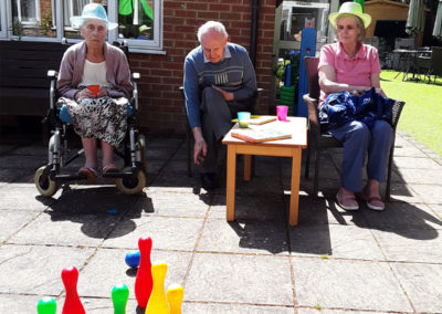 Residents playing skittles in the garden at Lulworth House Residential Care Home