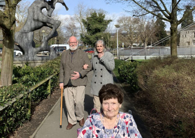 Lulworth House residents walking outside on their way to a bowling centre