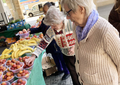 Residents looking at fruit and veg at Maidstone market