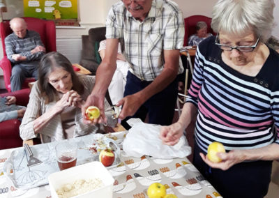 Residents peeling apples for crumble