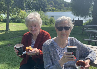 Two Lulworth ladies enjoying hot chocolates and doughnuts in the grounds of Leeds Castle