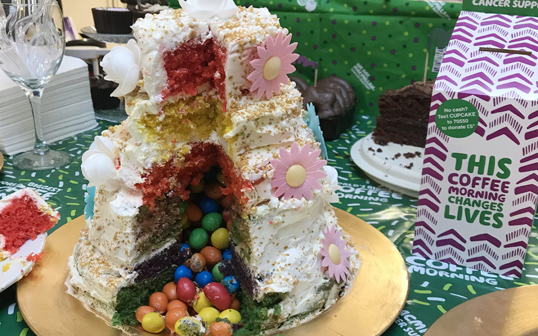 Lulworth House Residential Care Home create rainbow cake for Macmillan Coffee Morning