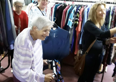 Residents browsing around a pop up clothes shop at Lulworth House