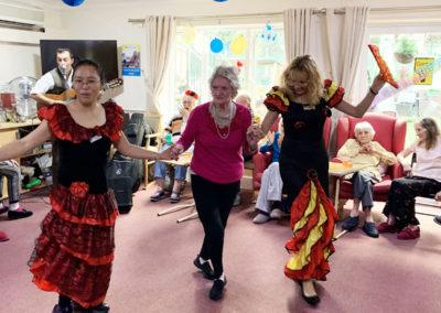 Staff and residents dancing at a Spanish party at Lulworth House
