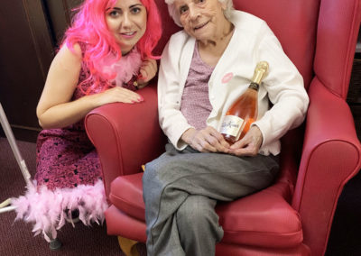 Resident and staff member on Wear it Pink Day