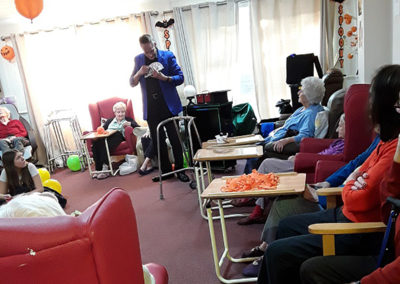 Marco the Magician entertaining Lulworth house residents with card tricks