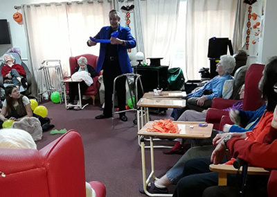 Marco the Magician entertaining Lulworth house residents with balloon animals