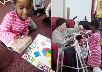 Nursery children playing board games with residents at Lulworth House