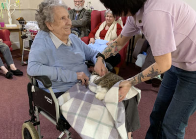 Ladies at Lulworth House Residential Care Home enjoying cuddles with a rabbit (6 of 6)