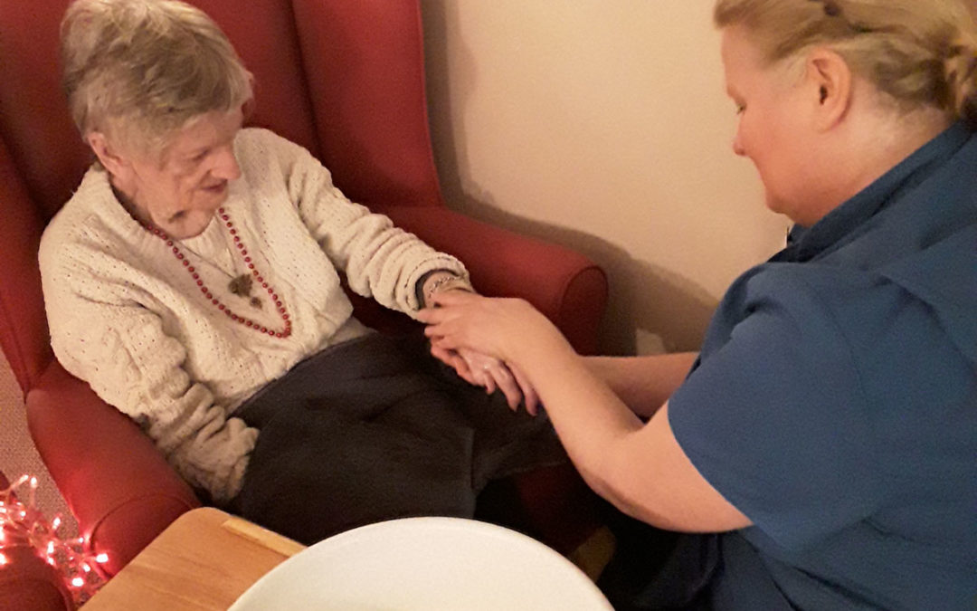 Embracing hand massage at Lulworth House Residential Care Home