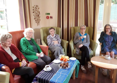 Group enjoying tea and cake at Lulworth House Residential Care Home