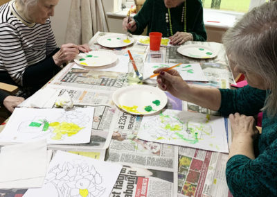Lady residents painting Spring flower pictures at Lulworth House