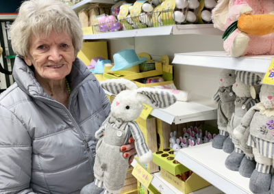 Lady resident at Lulworth in a shop browsing the Easter gifts and decorations