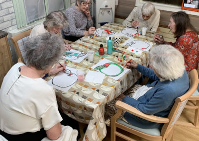 Lulworth House residents painting pictures of apples