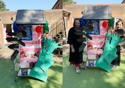 Lulworth House Residential Care Home staff with a Hollywood style decorated drinks trolley in the garden
