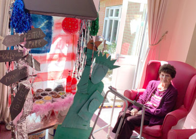 Lulworth House Residential Care Home resident sat next to the Hollywood style decorated drinks trolley