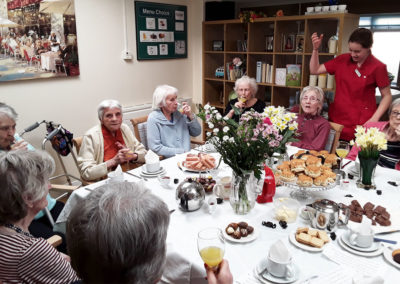 Lady residents enjoying Mother's Day cream tea at Lulworth House