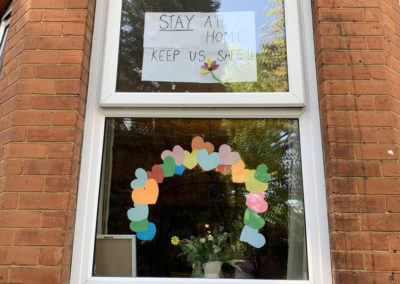Stay safe poster in the window at Lulworth House Residential Care Home