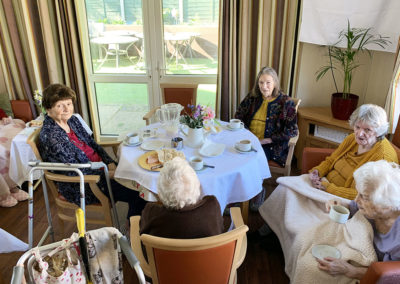 Residents enjoy tea and cake together at Lulworth House