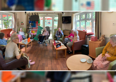 Residents at Lulworth House having a group chat in the lounge