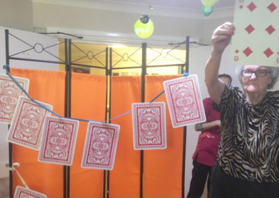 Large playing cards strung up for a game of Play Your Cards Right at Lulworth House Residential Care Home