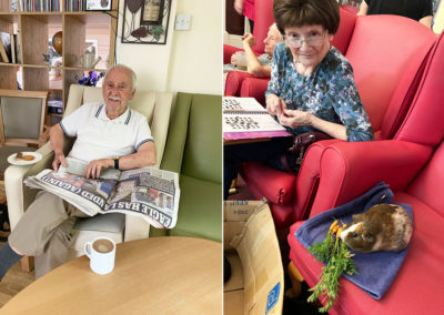 Lulworth House Residential Care Home residents relaxing with the papers and with the Home's Guinea pig
