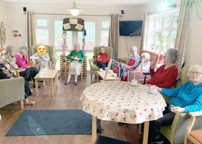 Lulworth House residents attending a church service in their lounge