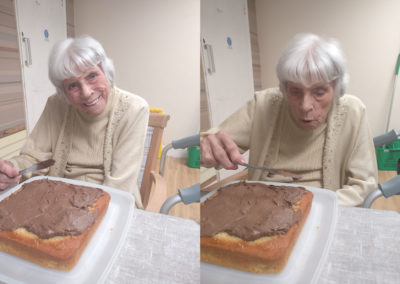 Lulworth House Residential Care Home resident icing a birthday cake