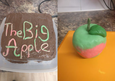 Iced birthday cake with an apple made out of icing