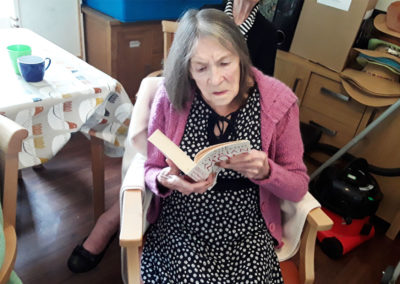 Lulworth House Residential Care Home resident reading a book
