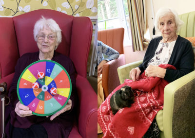 Lulworth House Residential Care Home resident a pet Guinea pig on her lap and one lady with a colourful dartboard
