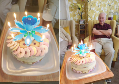Birthday cake decorated with biscuits and candles