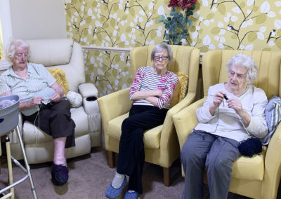 A group of residents knitting at Lulworth House Residential Care Home
