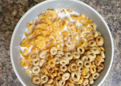 A bowl of mixed cereal with milk