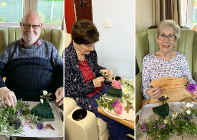 Residents making flowers arrangements at Lulworth House Residential Care Home
