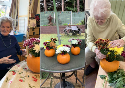 Flower arrangements with pumpkin vases