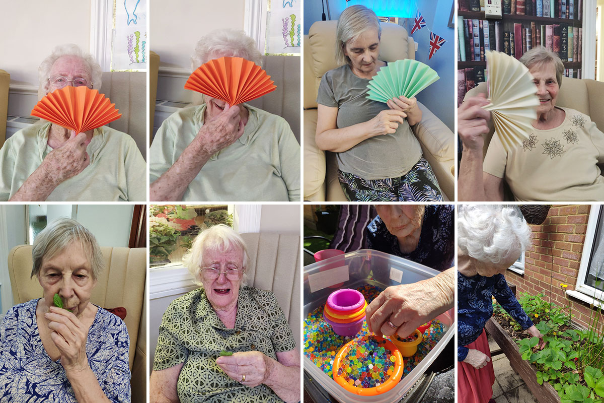 Lulworth House Residential Care Home residents keeping cool with paper fans and enjoying the garden