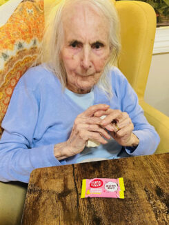 Resident with a Japanese Kit Kat at Lulworth House Residential Care Home
